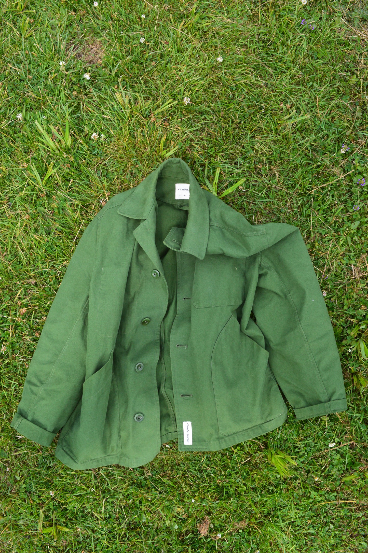 Green jacket on grass